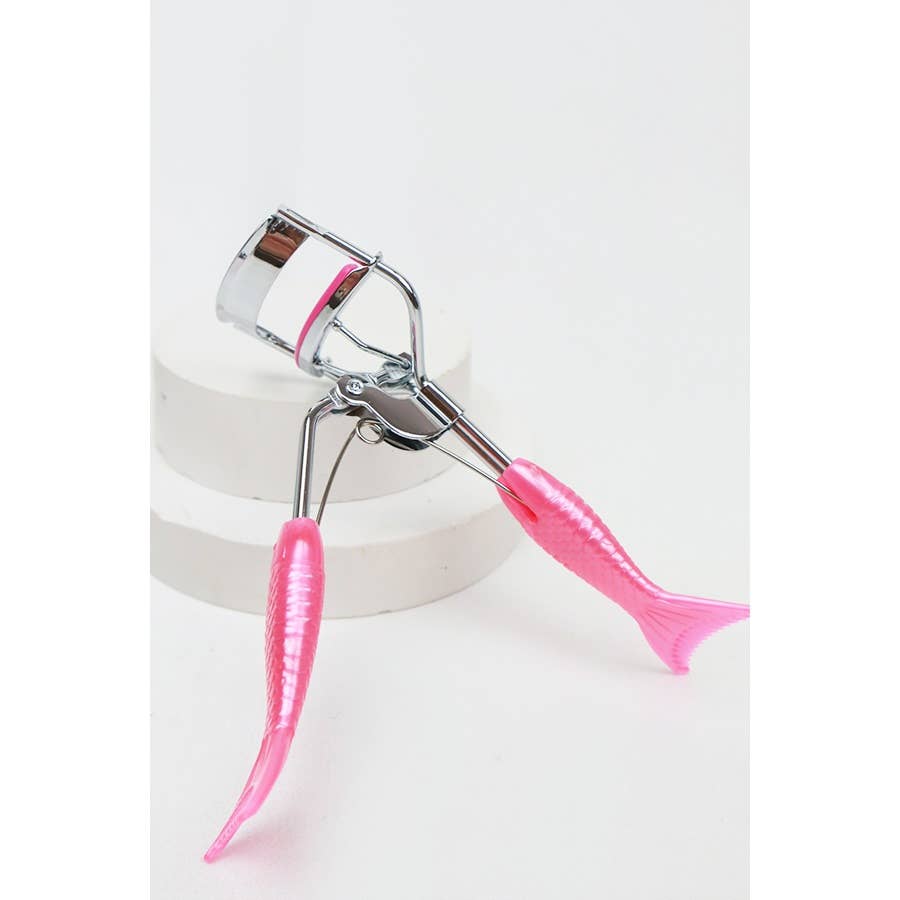 A set of four eyelash curlers displayed in glittery, holographic packaging. Each curler features a chrome metal frame with colorful silicone handles and matching curling pads in pastel shades of pink, purple, magenta, and blue. The packaging highlights their "Ultra-Wide Field" design, emphasizing functionality and style. Perfect for beauty enthusiasts seeking a pop of color in their makeup tools.