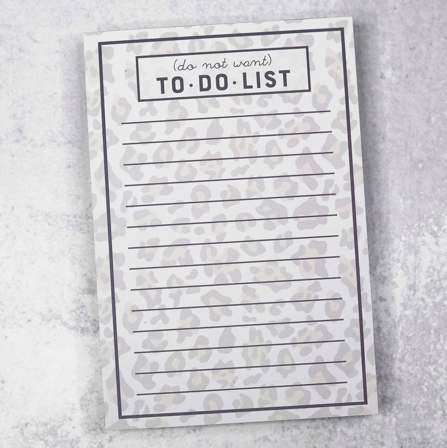 A lined notepad with a subtle gray leopard print background. The header reads "(do not want) TO-DO LIST" in bold black text with lined sections below for writing tasks.