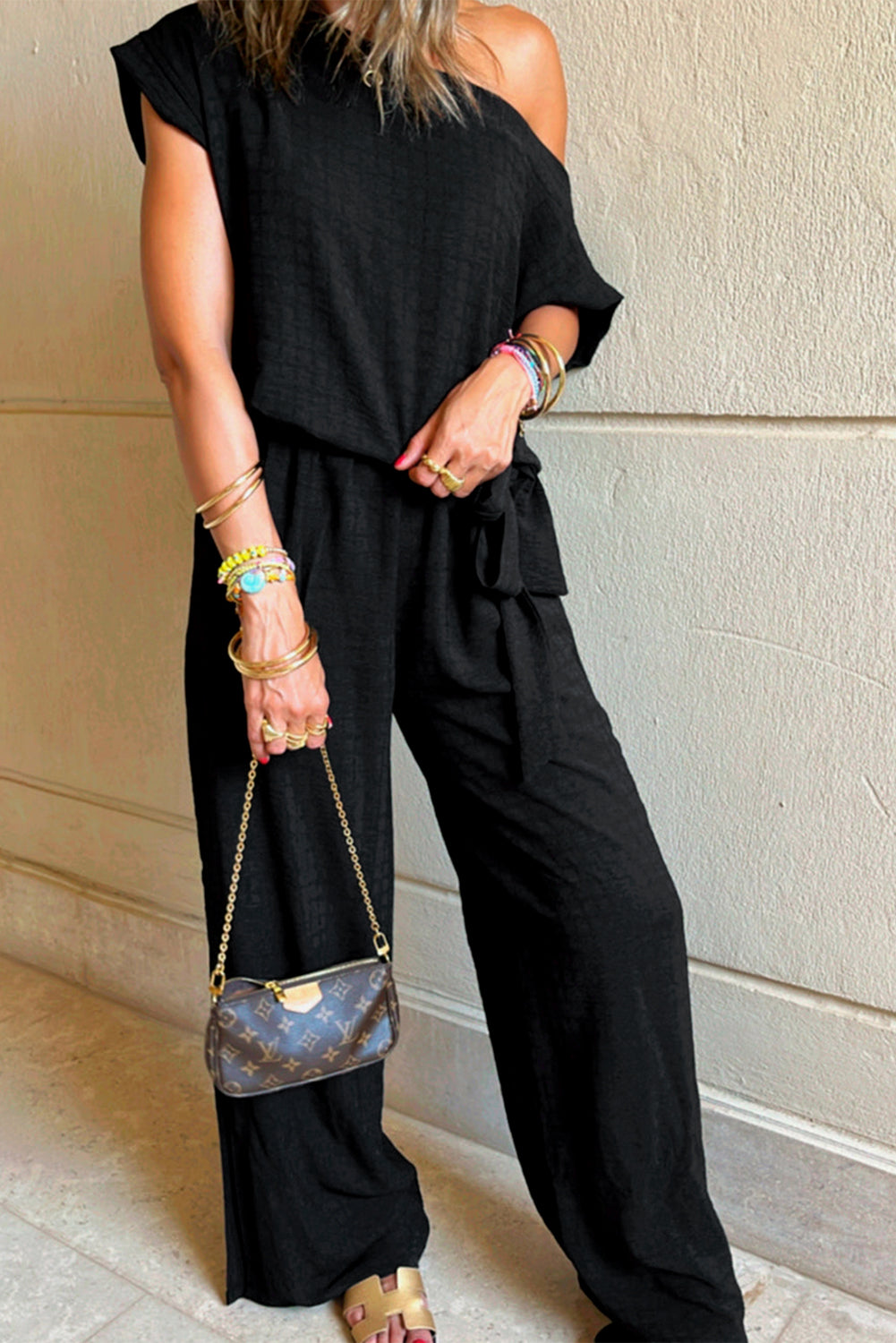 Black checkered short sleeve romper, trendy one-piece outfit, casual romper for women, stylish summer romper, effortless fashion, comfortable and chic romper, must-have wardrobe essential, street style fashion, versatile romper outfit, easy-to-wear romper, fashion-forward romper, everyday casual look, modern and stylish romper, flattering romper for all body types, lightweight and breathable outfit, day-to-night fashion, mom outfits