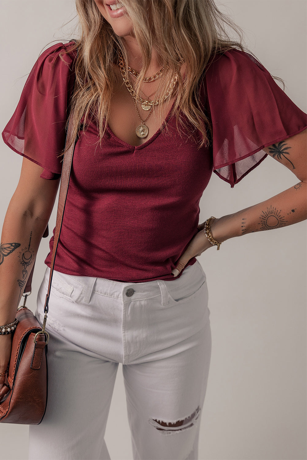Mesh ruffled sleeve slim fit V-neck top, stylish V-neck blouse, ruffled sleeve top, feminine mesh details, trendy slim fit top, chic and elegant blouse, versatile layering piece, breathable mesh fabric, casual yet sophisticated look, flattering V-neckline, lightweight and comfortable top, perfect for day-to-night wear, modern fashion top, on-trend blouse, edgy yet feminine style, fashion-forward ruffled sleeves, effortlessly stylish top, must-have wardrobe item, perfect for layering or wearing solo