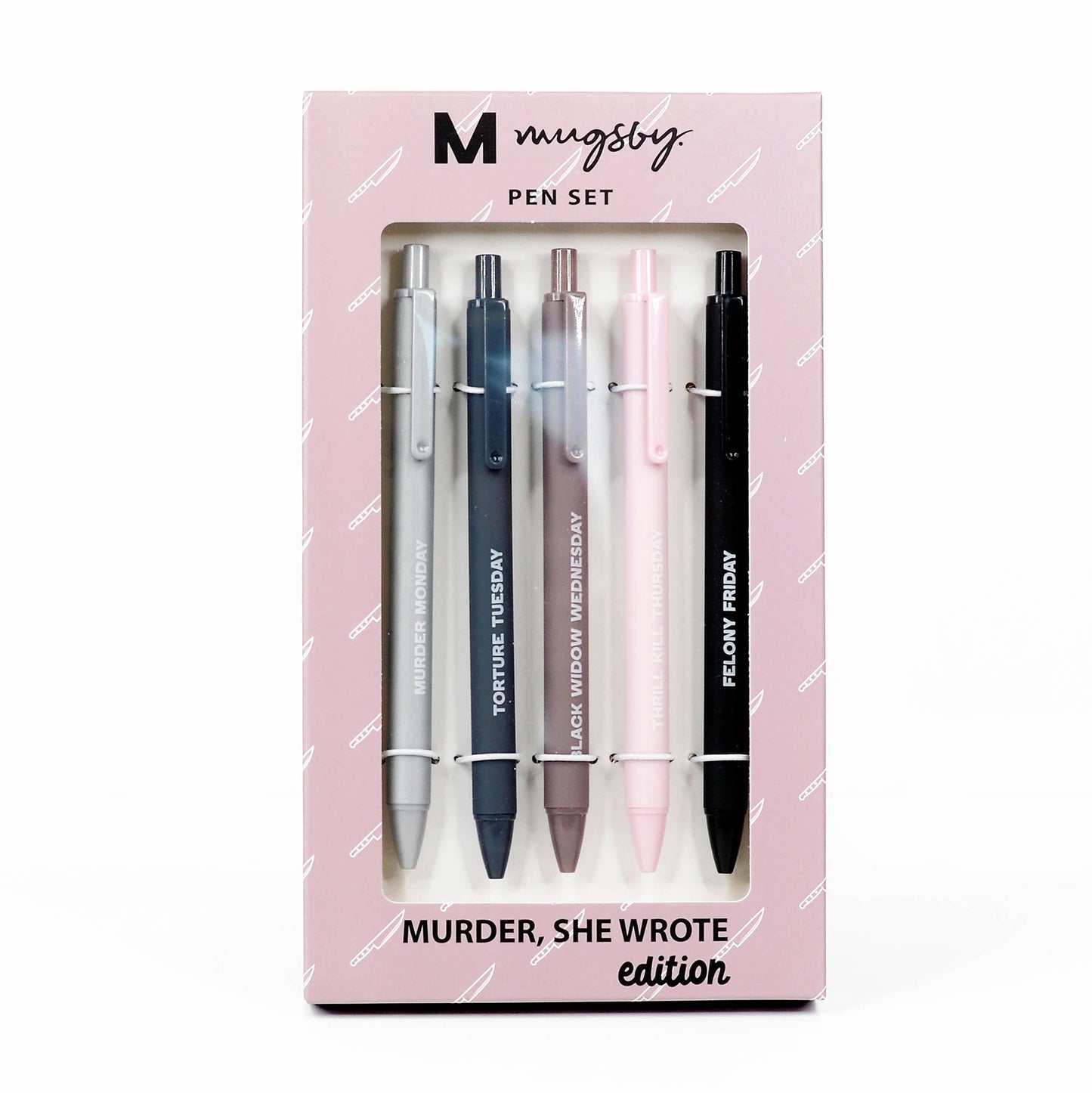 Monochrome pen set in sleek gray, black, and blush tones with phrases like 'Murder Monday' and 'Felony Friday,' packaged in a pink box. A quirky and edgy addition to any desk or writing set.