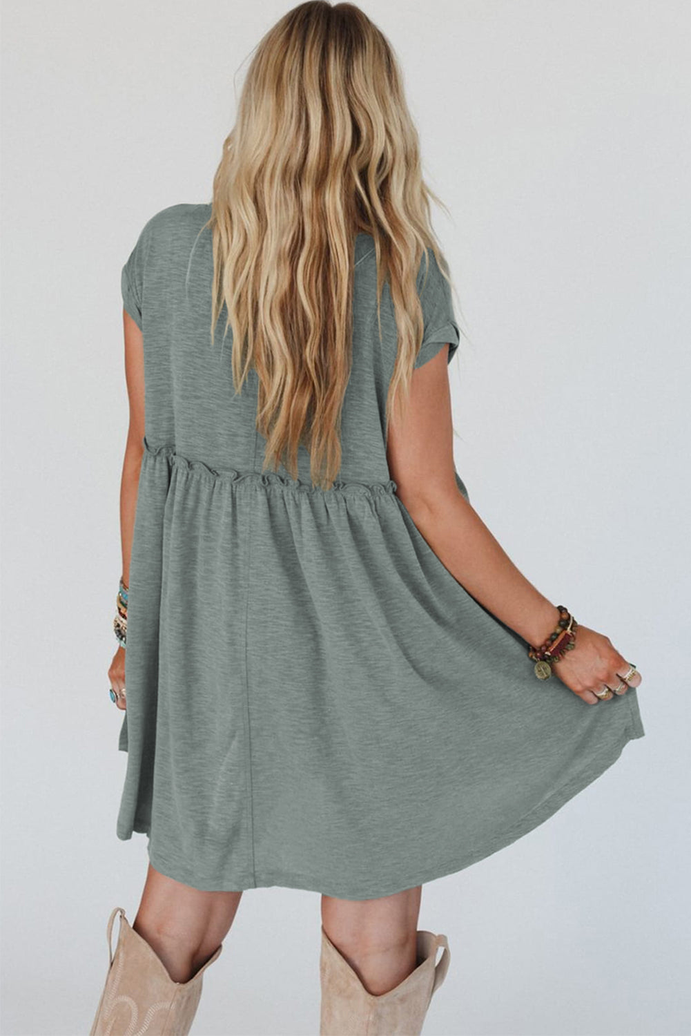 Frilled pleated t-shirt dress, casual t-shirt dress, pleated detail dress, feminine frilled dress, versatile day-to-night dress, comfortable and stylish dress, lightweight pleated t-shirt dress, relaxed fit dress, trendy pleated hem, effortless summer dress, relaxed yet flattering silhouette, must-have wardrobe piece, easy-to-wear casual dress, chic and comfortable outfit, perfect for any occasion, spring 2025, summer 2025 outfits