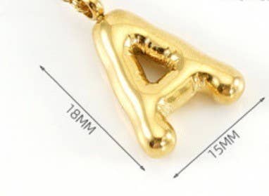 "Gold-tone necklace featuring a puffed, balloon-style pendant in the shape of the letter 'K,' suspended from a delicate gold chain. Stylish and minimalistic, ideal for personalizing any outfit."