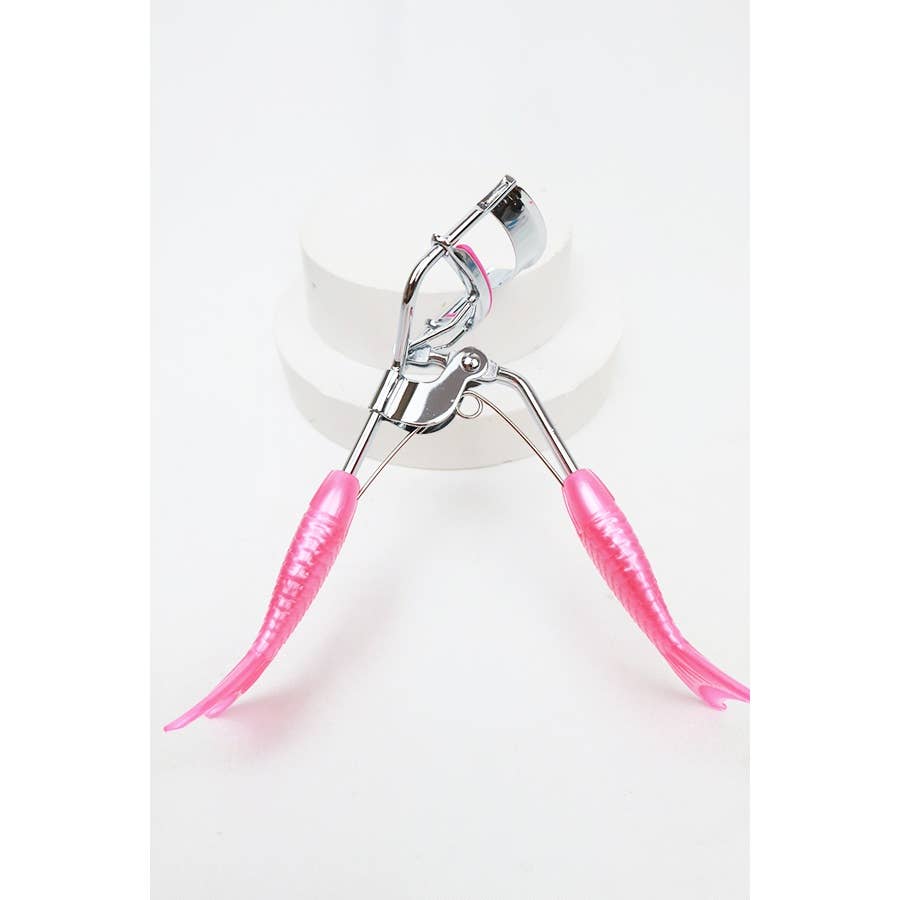 A set of four eyelash curlers displayed in glittery, holographic packaging. Each curler features a chrome metal frame with colorful silicone handles and matching curling pads in pastel shades of pink, purple, magenta, and blue. The packaging highlights their "Ultra-Wide Field" design, emphasizing functionality and style. Perfect for beauty enthusiasts seeking a pop of color in their makeup tools.