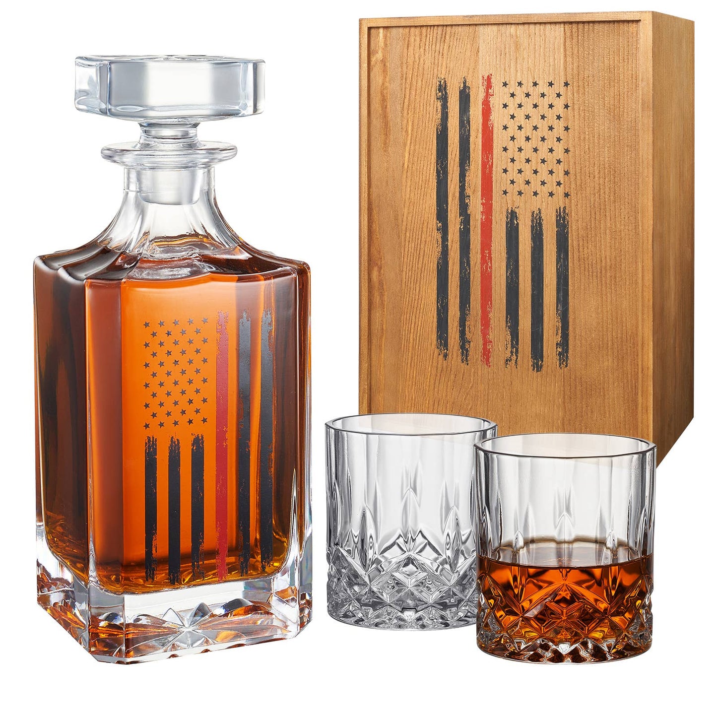 Elegant whiskey decanter set featuring a glass decanter and two crystal glasses with an etched American flag design, packaged in a rustic wooden box adorned with a matching flag pattern.