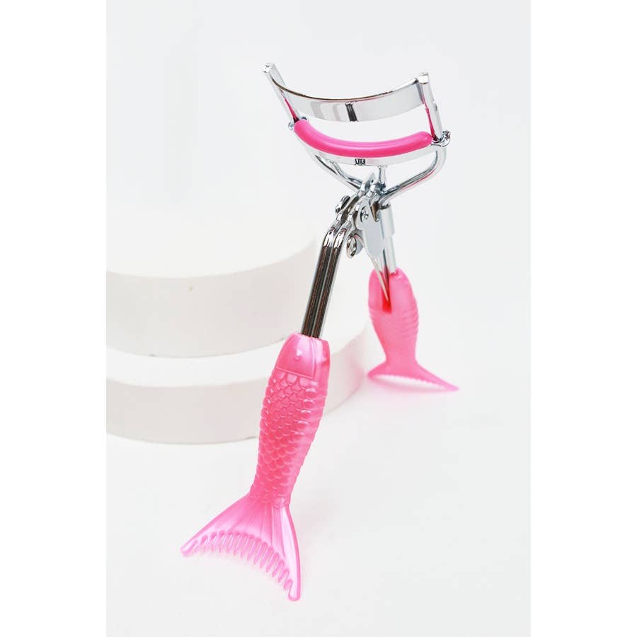 A set of four eyelash curlers displayed in glittery, holographic packaging. Each curler features a chrome metal frame with colorful silicone handles and matching curling pads in pastel shades of pink, purple, magenta, and blue. The packaging highlights their "Ultra-Wide Field" design, emphasizing functionality and style. Perfect for beauty enthusiasts seeking a pop of color in their makeup tools.