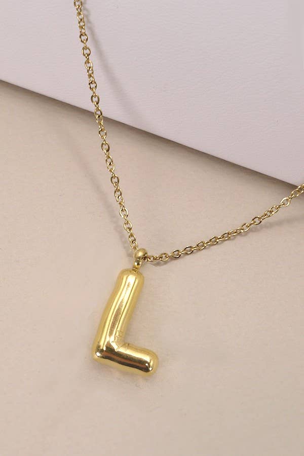 "Gold-tone necklace featuring a puffed, balloon-style pendant in the shape of the letter 'L,' suspended from a delicate gold chain. Stylish and minimalistic, ideal for personalizing any outfit."