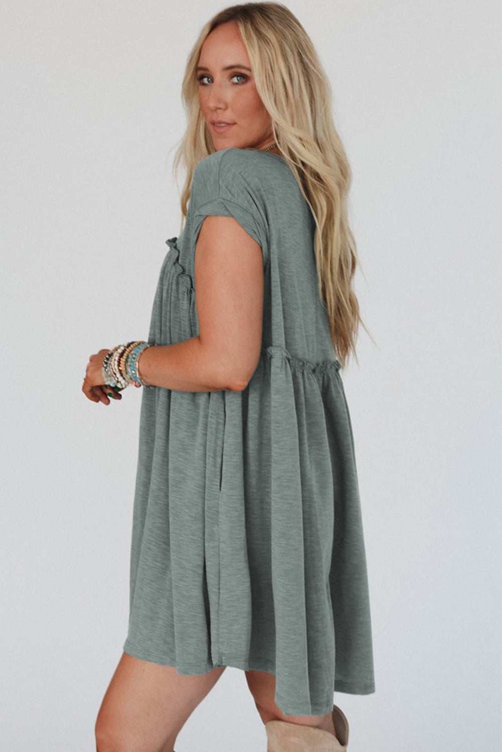 Frilled pleated t-shirt dress, casual t-shirt dress, pleated detail dress, feminine frilled dress, versatile day-to-night dress, comfortable and stylish dress, lightweight pleated t-shirt dress, relaxed fit dress, trendy pleated hem, effortless summer dress, relaxed yet flattering silhouette, must-have wardrobe piece, easy-to-wear casual dress, chic and comfortable outfit, perfect for any occasion, spring 2025, summer 2025 outfits