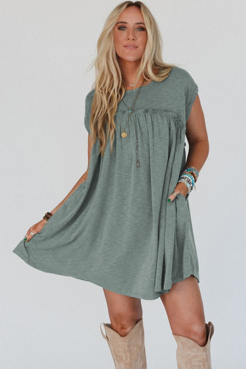 Frilled pleated t-shirt dress, casual t-shirt dress, pleated detail dress, feminine frilled dress, versatile day-to-night dress, comfortable and stylish dress, lightweight pleated t-shirt dress, relaxed fit dress, trendy pleated hem, effortless summer dress, relaxed yet flattering silhouette, must-have wardrobe piece, easy-to-wear casual dress, chic and comfortable outfit, perfect for any occasion, spring 2025, summer 2025 outfits