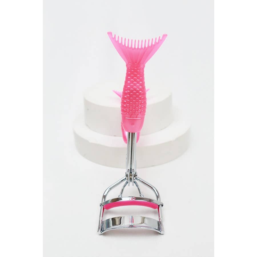 A set of four eyelash curlers displayed in glittery, holographic packaging. Each curler features a chrome metal frame with colorful silicone handles and matching curling pads in pastel shades of pink, purple, magenta, and blue. The packaging highlights their "Ultra-Wide Field" design, emphasizing functionality and style. Perfect for beauty enthusiasts seeking a pop of color in their makeup tools.