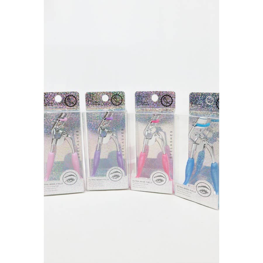 A set of four eyelash curlers displayed in glittery, holographic packaging. Each curler features a chrome metal frame with colorful silicone handles and matching curling pads in pastel shades of pink, purple, magenta, and blue. The packaging highlights their "Ultra-Wide Field" design, emphasizing functionality and style. Perfect for beauty enthusiasts seeking a pop of color in their makeup tools.