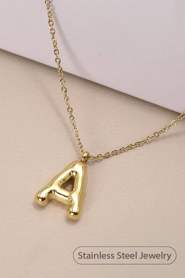 "Gold-tone necklace featuring a puffed, balloon-style pendant in the shape of the letter 'A,' suspended from a delicate gold chain. Stylish and minimalistic, ideal for personalizing any outfit."