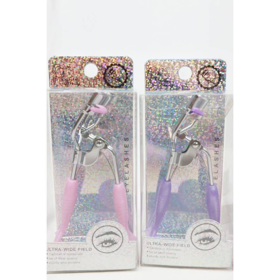 A set of four eyelash curlers displayed in glittery, holographic packaging. Each curler features a chrome metal frame with colorful silicone handles and matching curling pads in pastel shades of pink, purple, magenta, and blue. The packaging highlights their "Ultra-Wide Field" design, emphasizing functionality and style. Perfect for beauty enthusiasts seeking a pop of color in their makeup tools.