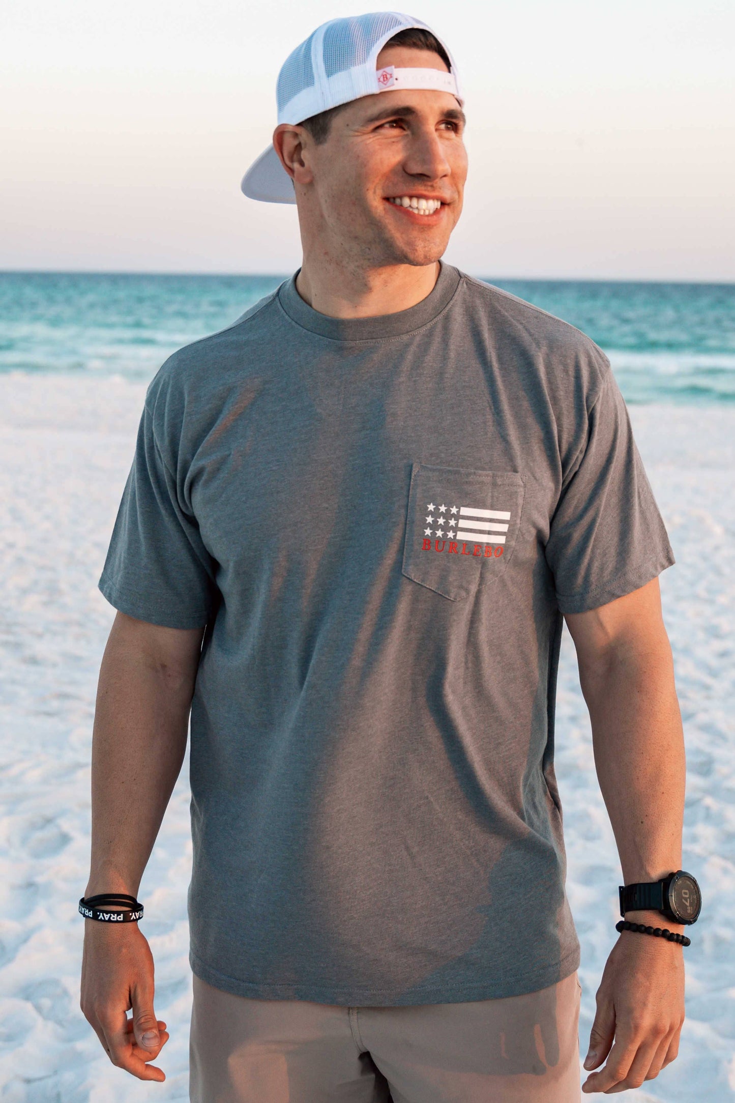 Burlebo grey and blue shirt with 'America is too great for small dreams' slogan, patriotic graphic tee, men's and women's American pride shirt, soft and comfortable Burlebo brand apparel, USA-inspired casual shirt