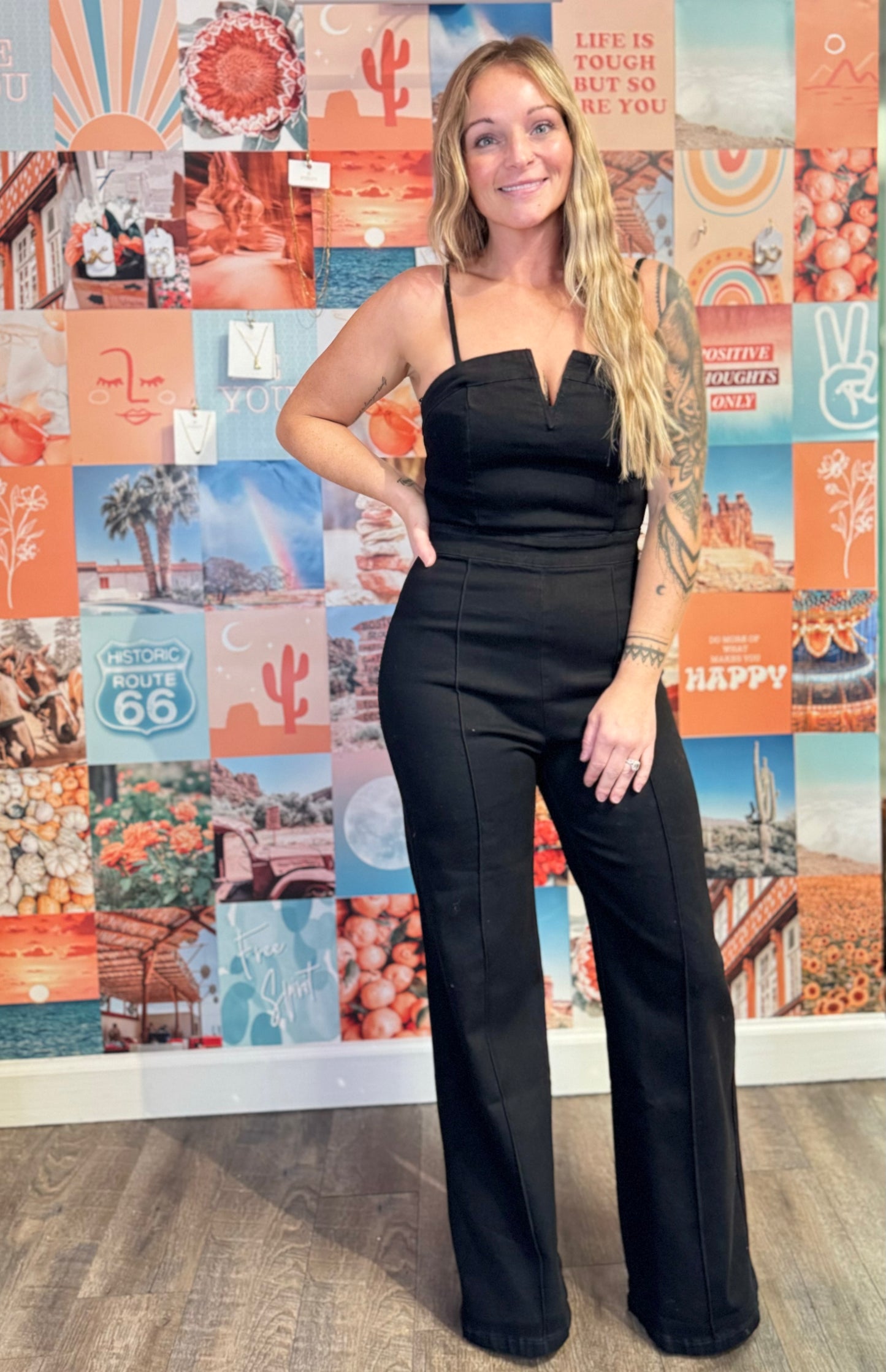 High-waisted flared denim jumpsuit, stylish women's one-piece outfit, trendy wide-leg flare design, flattering high-waisted fit, versatile denim jumpsuit for casual or dressy occasions, comfortable and chic fashion statement