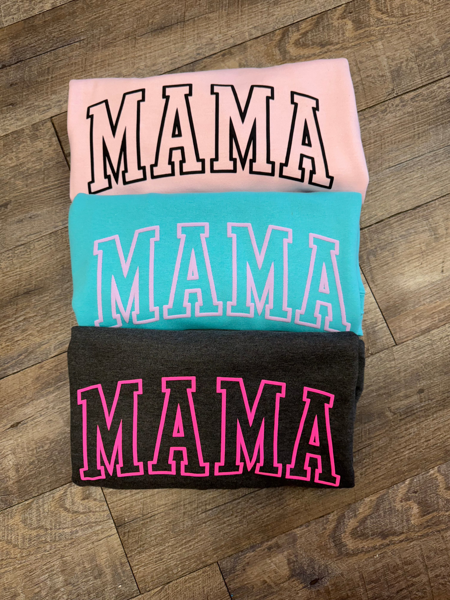 Stylish Mama crewneck sweatshirt for women, featuring a comfortable and relaxed fit with a bold 'Mama' graphic design. Perfect for casual wear or lounging, this soft sweatshirt offers warmth and cozy comfort. Made from high-quality fabric, it pairs effortlessly with jeans, leggings, or shorts for an easy, chic look. Available in various sizes and colors, this crewneck sweatshirt is a must-have for moms looking for both comfort and style in their everyday wardrobe