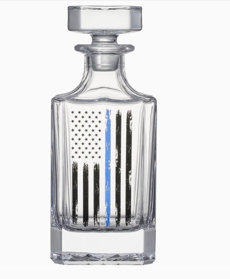 Crystal whiskey decanter and glasses set featuring an etched American flag design, accompanied by a wooden box with a matching flag motif.
