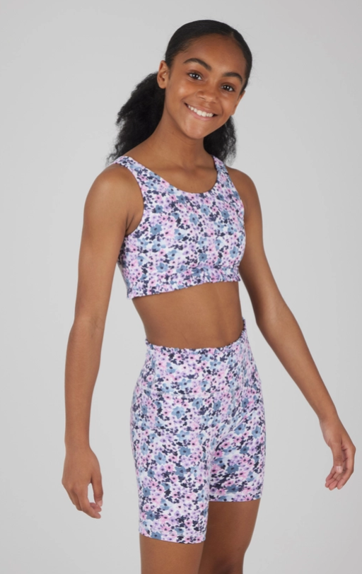 Set of three vibrant two-piece activewear outfits for girls, featuring tank tops and matching high-waisted biker shorts. The designs include, A pastel splatter print in shades of pink, blue, and purple with a playful ruffled hem on the top. These comfortable and trendy outfits are ideal for workouts, dance, or casual activities.