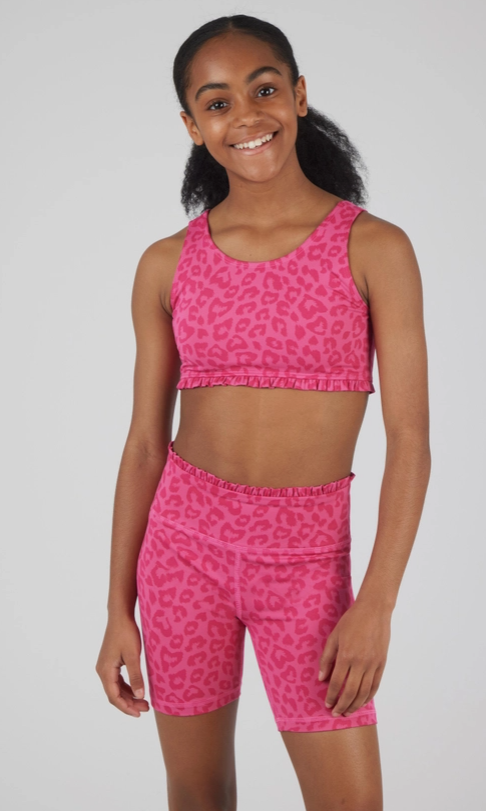 Set of three vibrant two-piece activewear outfits for girls, featuring tank tops and matching high-waisted biker shorts. The designs include, A bold hot pink set with a leopard print pattern and matching ruffle detail. These comfortable and trendy outfits are ideal for workouts, dance, or casual activities.