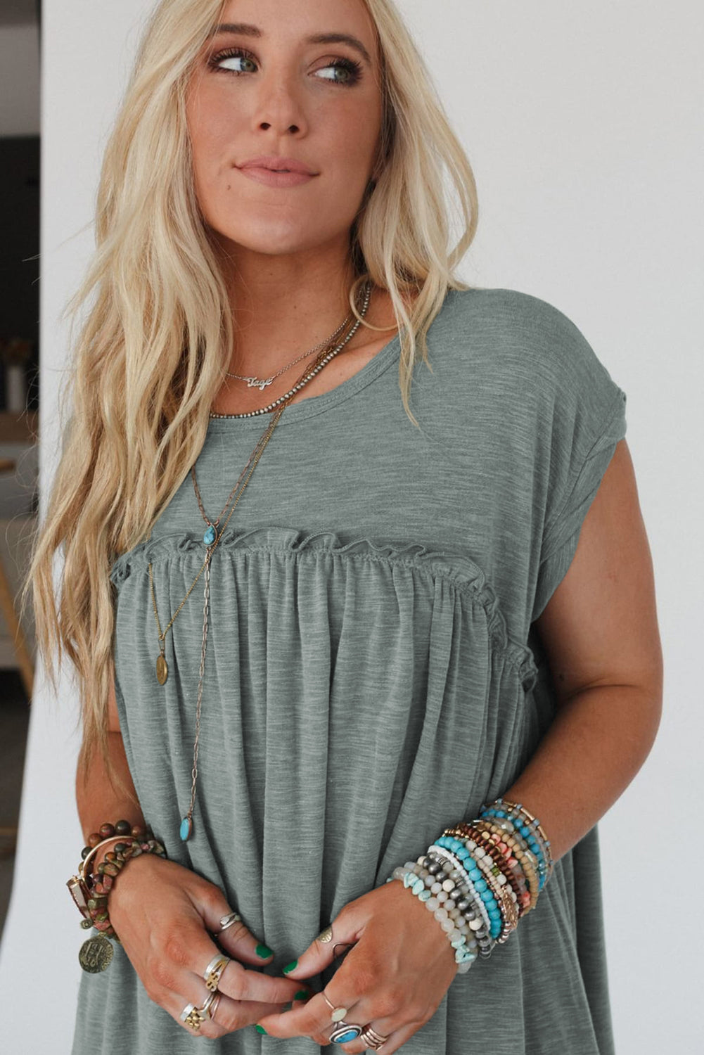 Frilled pleated t-shirt dress, casual t-shirt dress, pleated detail dress, feminine frilled dress, versatile day-to-night dress, comfortable and stylish dress, lightweight pleated t-shirt dress, relaxed fit dress, trendy pleated hem, effortless summer dress, relaxed yet flattering silhouette, must-have wardrobe piece, easy-to-wear casual dress, chic and comfortable outfit, perfect for any occasion, spring 2025, summer 2025 outfits