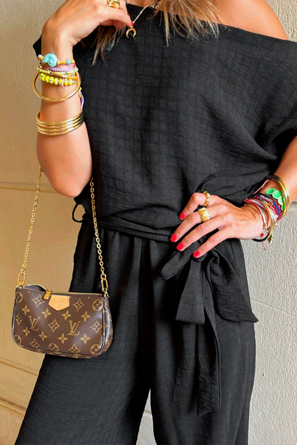 Black checkered short sleeve romper, trendy one-piece outfit, casual romper for women, stylish summer romper, effortless fashion, comfortable and chic romper, must-have wardrobe essential, street style fashion, versatile romper outfit, easy-to-wear romper, fashion-forward romper, everyday casual look, modern and stylish romper, flattering romper for all body types, lightweight and breathable outfit, day-to-night fashion, mom outfits