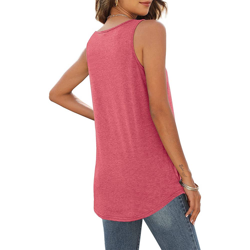 A woman dressed in a sleeveless red tank top with a pleated front detail and a rounded hem, styled with distressed blue jeans. She holds a beige clutch bag and wears layered necklaces, completing a chic and casual outfit.
