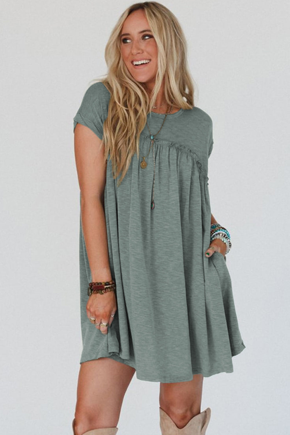 Frilled pleated t-shirt dress, casual t-shirt dress, pleated detail dress, feminine frilled dress, versatile day-to-night dress, comfortable and stylish dress, lightweight pleated t-shirt dress, relaxed fit dress, trendy pleated hem, effortless summer dress, relaxed yet flattering silhouette, must-have wardrobe piece, easy-to-wear casual dress, chic and comfortable outfit, perfect for any occasion, spring 2025, summer 2025 outfits