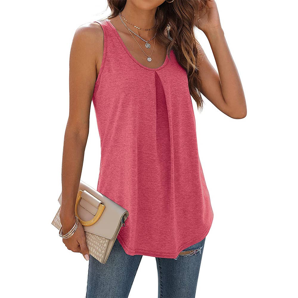 A woman dressed in a sleeveless red tank top with a pleated front detail and a rounded hem, styled with distressed blue jeans. She holds a beige clutch bag and wears layered necklaces, completing a chic and casual outfit.