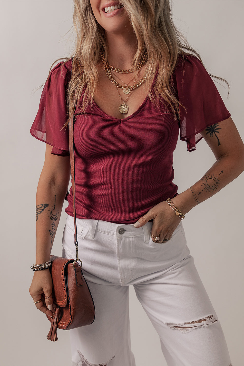 Mesh ruffled sleeve slim fit V-neck top, stylish V-neck blouse, ruffled sleeve top, feminine mesh details, trendy slim fit top, chic and elegant blouse, versatile layering piece, breathable mesh fabric, casual yet sophisticated look, flattering V-neckline, lightweight and comfortable top, perfect for day-to-night wear, modern fashion top, on-trend blouse, edgy yet feminine style, fashion-forward ruffled sleeves, effortlessly stylish top, must-have wardrobe item, perfect for layering or wearing solo