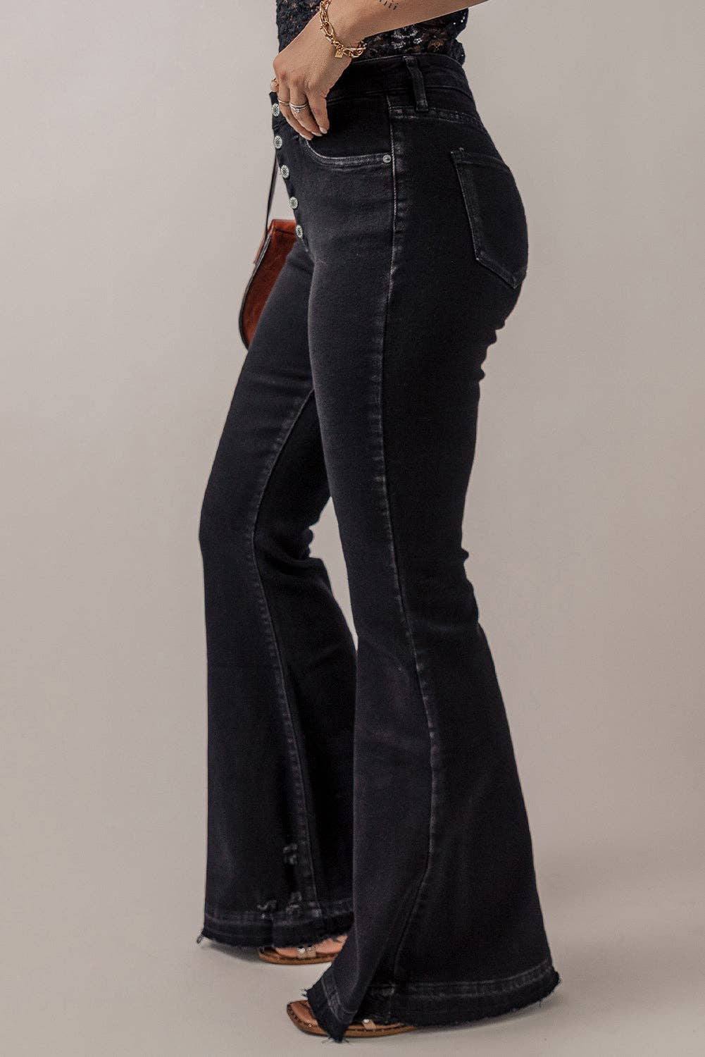 High waist button front flare jeans for women, offering a retro-inspired style with a flattering, fitted waist and flare leg design. Perfect for casual outfits, date nights, or vintage fashion looks. These stylish high-rise flare jeans feature button detailing for added flair and comfort. Available in various sizes for women, ideal for pairing with tops, blouses, or sweaters. Trendy and versatile flare jeans for a chic, fashion-forward wardrobe