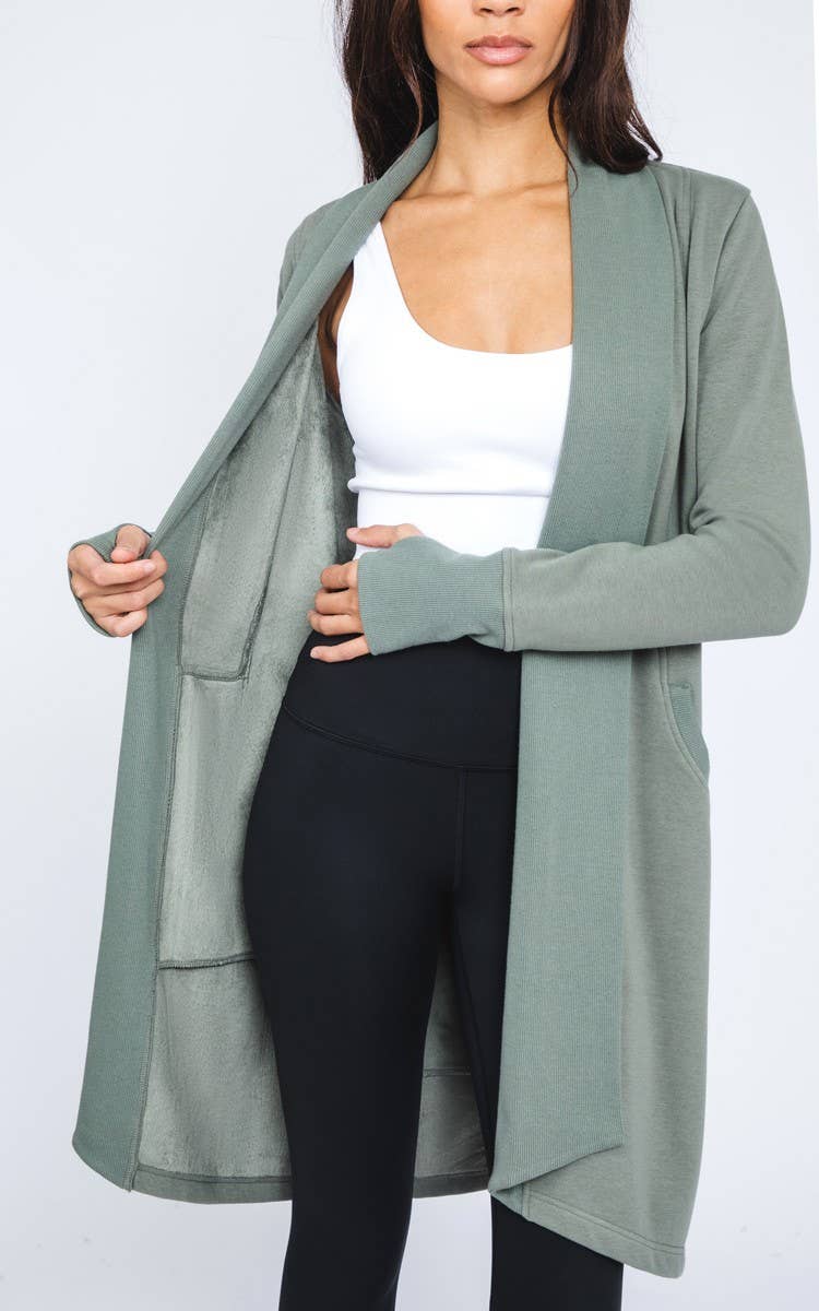 Cozy long sleeve fleece-lined cardigan for women, offering warmth and comfort with soft fleece lining and a relaxed fit. Perfect for fall and winter layering, this open-front cardigan is ideal for casual wear, outdoor activities, or staying warm indoors. Made with durable knit fabric, this fleece-lined cardigan pairs easily with jeans, leggings, or dresses for a stylish, versatile look. Available in various sizes and colors, this must-have cardigan provides both comfort and fashion