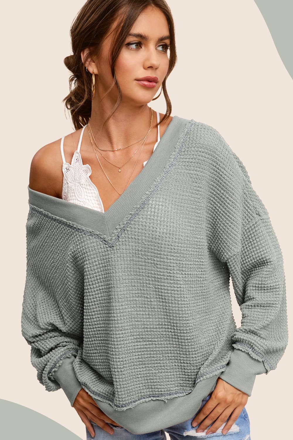 Comfortable loose fit long sleeve waffle textured top for women, featuring a relaxed silhouette and soft, breathable fabric. Ideal for casual wear, this stylish top offers a cozy and laid-back look, perfect for layering or wearing on its own. The unique waffle texture adds dimension and visual interest, making it a versatile piece for everyday outfits. Available in various sizes and colors, this loose fit long sleeve top is perfect for pairing with jeans, leggings, or skirts