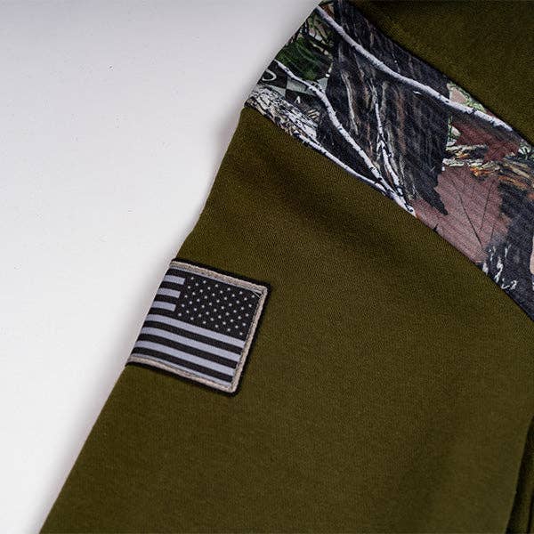 Stylish military green camo hoodie for men and women, featuring a bold camouflage print and a comfortable, relaxed fit. Perfect for casual outings, outdoor activities, or layering in cooler weather, this hoodie offers both warmth and an edgy, trendy look. Made from soft, breathable fabric, it includes a hood with adjustable drawstrings for added comfort. Available in various sizes, this versatile camo hoodie is a must-have for those looking to add a touch of military-inspired style to their wardrobe
