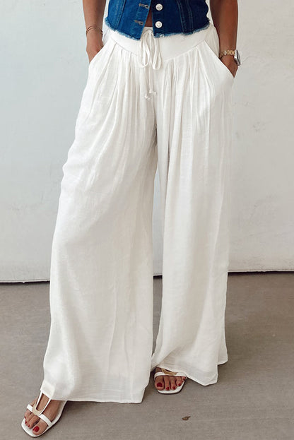 These drop waist wide leg linen pants are a must for your capsule wardrobe. Lightweight, breathable, and made for beach days, travel looks, or casual brunch vibes. Style with a cropped tee and sandals for the perfect relaxed fit