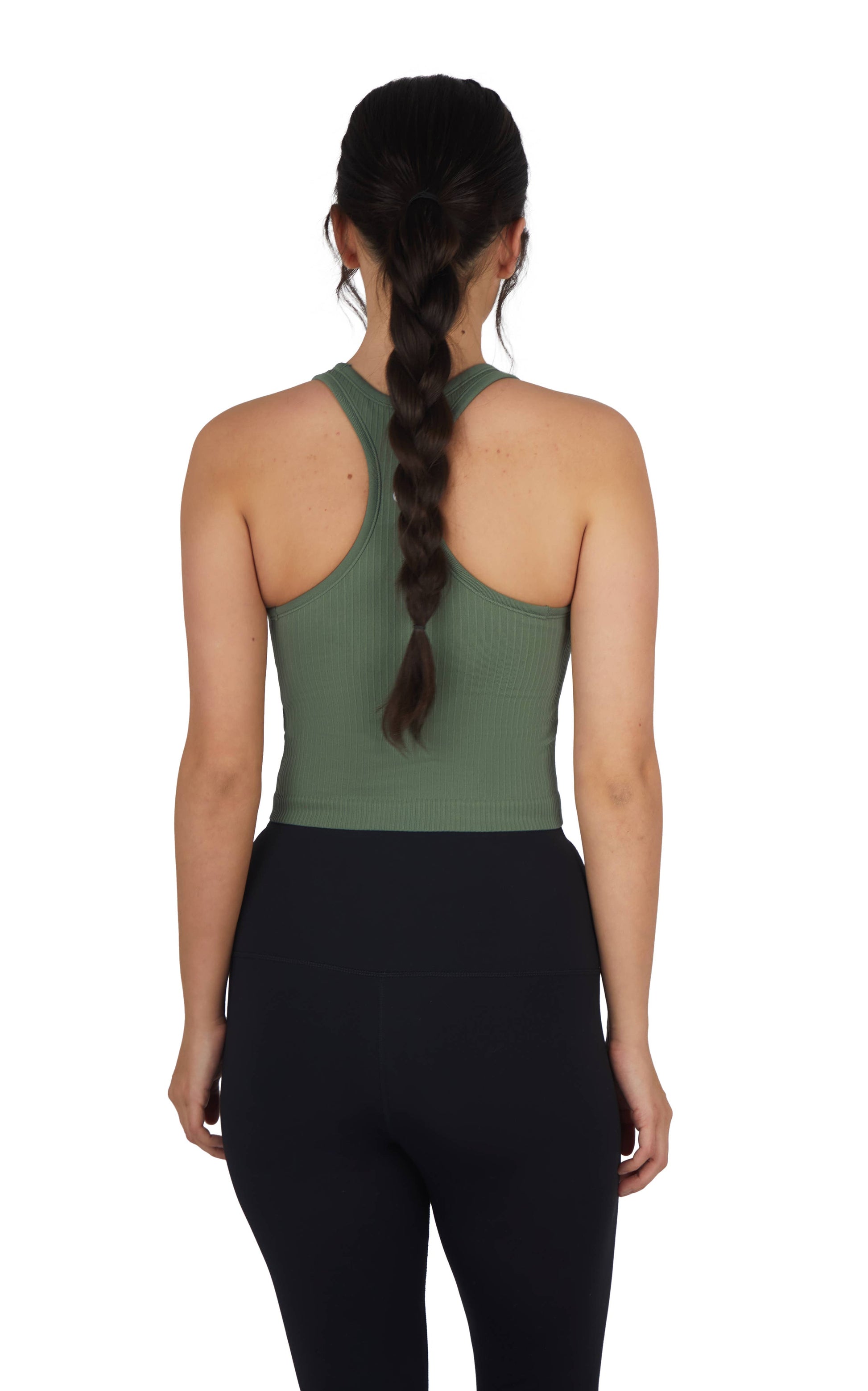 A woman wearing a ribbed, racerback cropped tank top in sage green paired with high-waisted black leggings. The outfit highlights a sleek and casual activewear look, suitable for workouts or everyday athleisure style. The plain white background keeps the focus on the clothing.