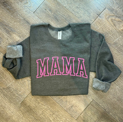 Stylish Mama crewneck sweatshirt for women, featuring a comfortable and relaxed fit with a bold 'Mama' graphic design. Perfect for casual wear or lounging, this soft sweatshirt offers warmth and cozy comfort. Made from high-quality fabric, it pairs effortlessly with jeans, leggings, or shorts for an easy, chic look. Available in various sizes and colors, this crewneck sweatshirt is a must-have for moms looking for both comfort and style in their everyday wardrobe